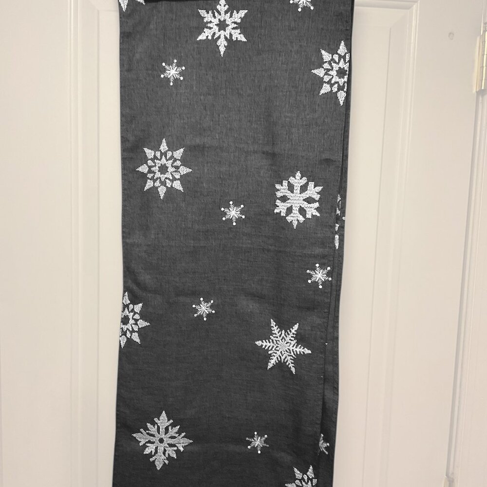 Grey and white embroidered snowflake table runner